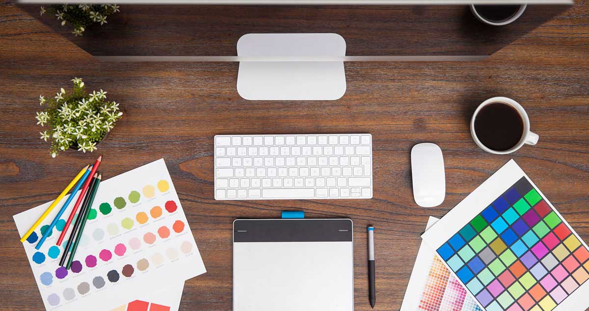 Graphic Design Desk with color swatches and computer